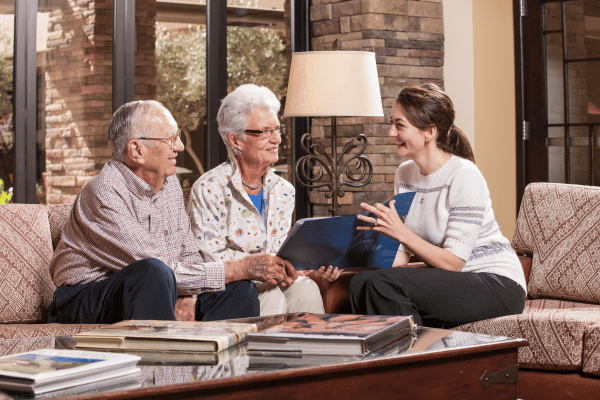 Senior couple speaking with a younger woman. | Waypoint Converts