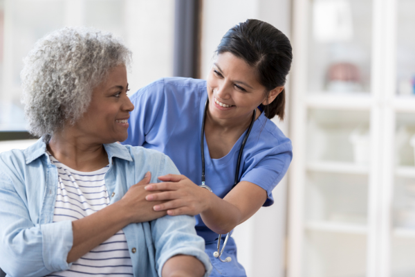 Older woman and a nurse.